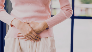 urinary symptoms women - woman in discomfort or pain